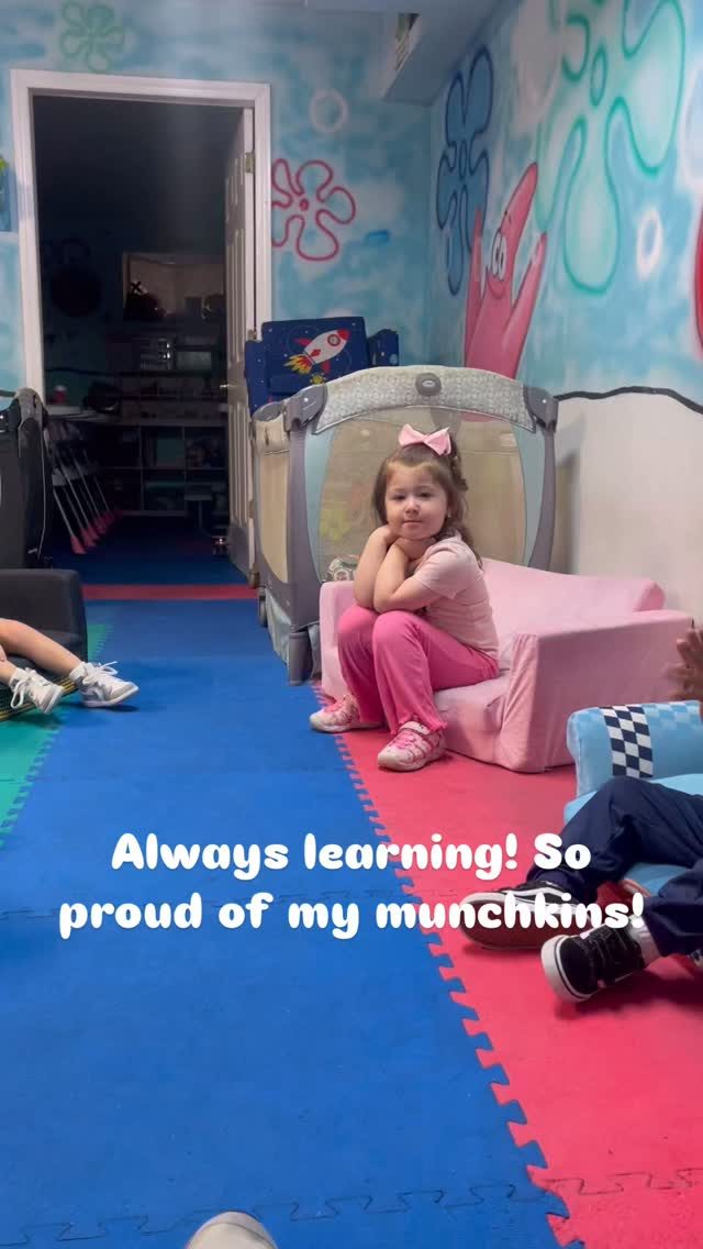 Two children sitting together at the daycare table