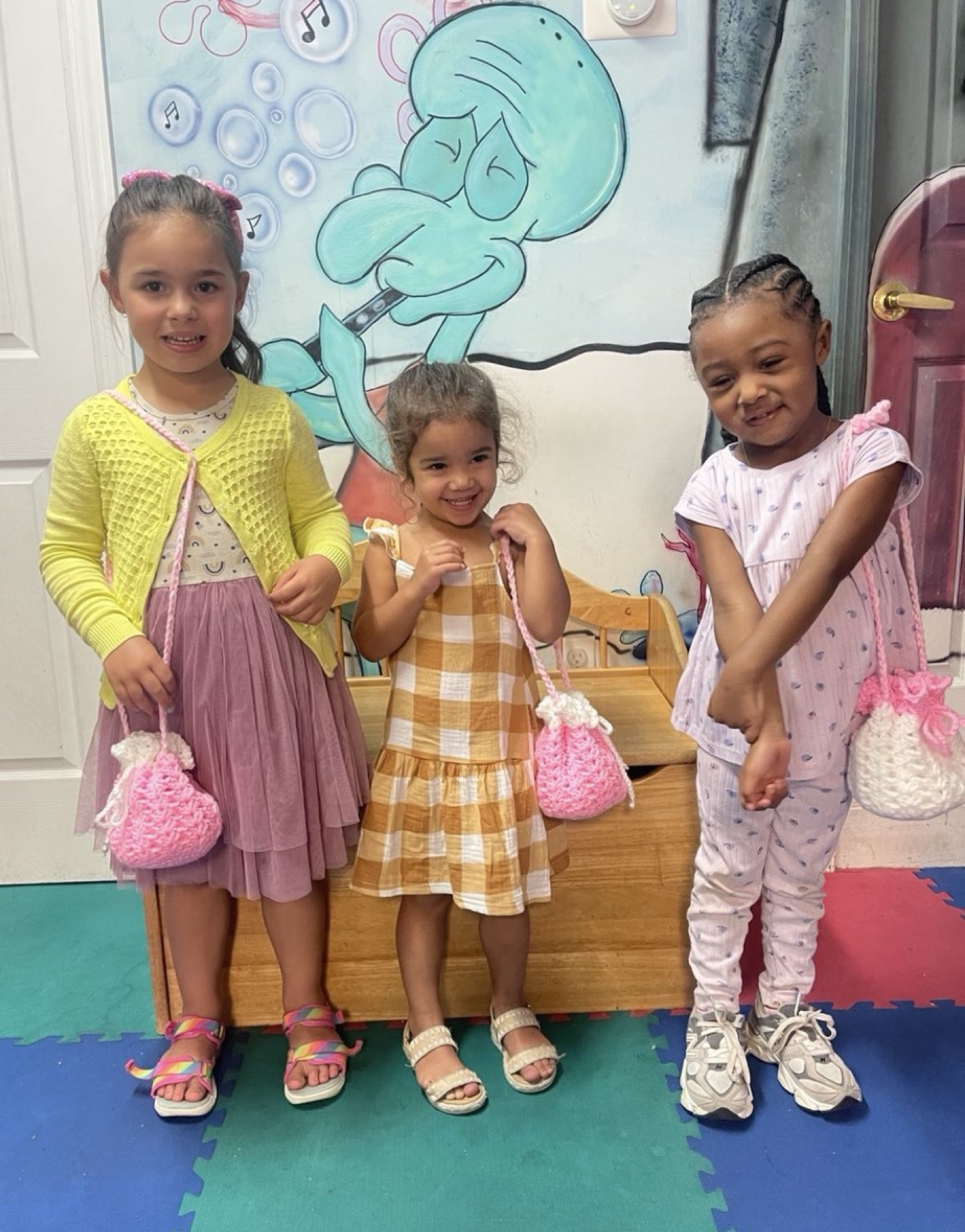 Children showing handmade bags at My Piccolo Mondo