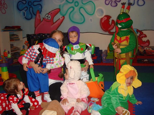 Children painting together during preschool preparation at My Piccolo Mondo