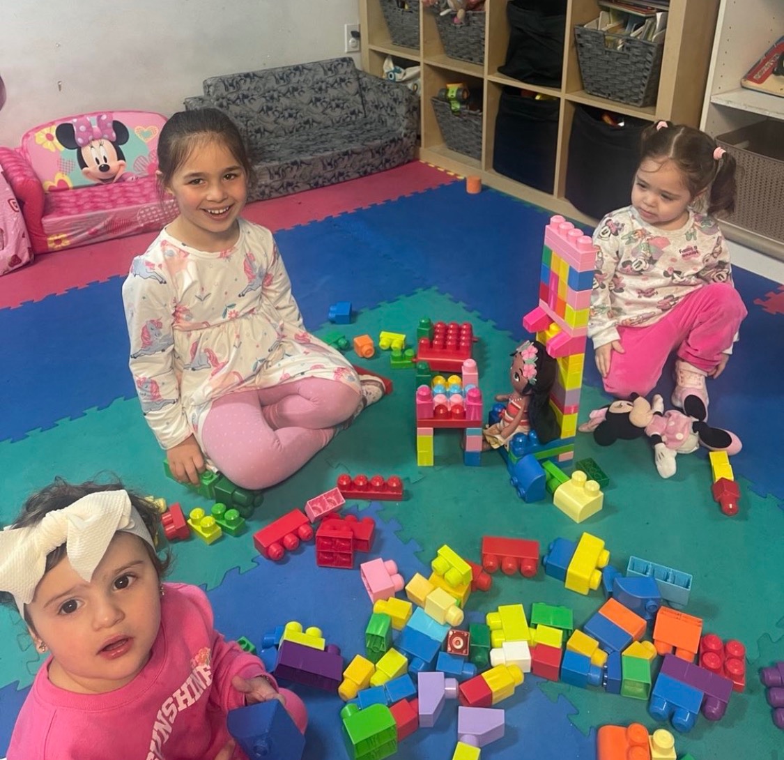 Children at the activity table at My Piccolo Mondo